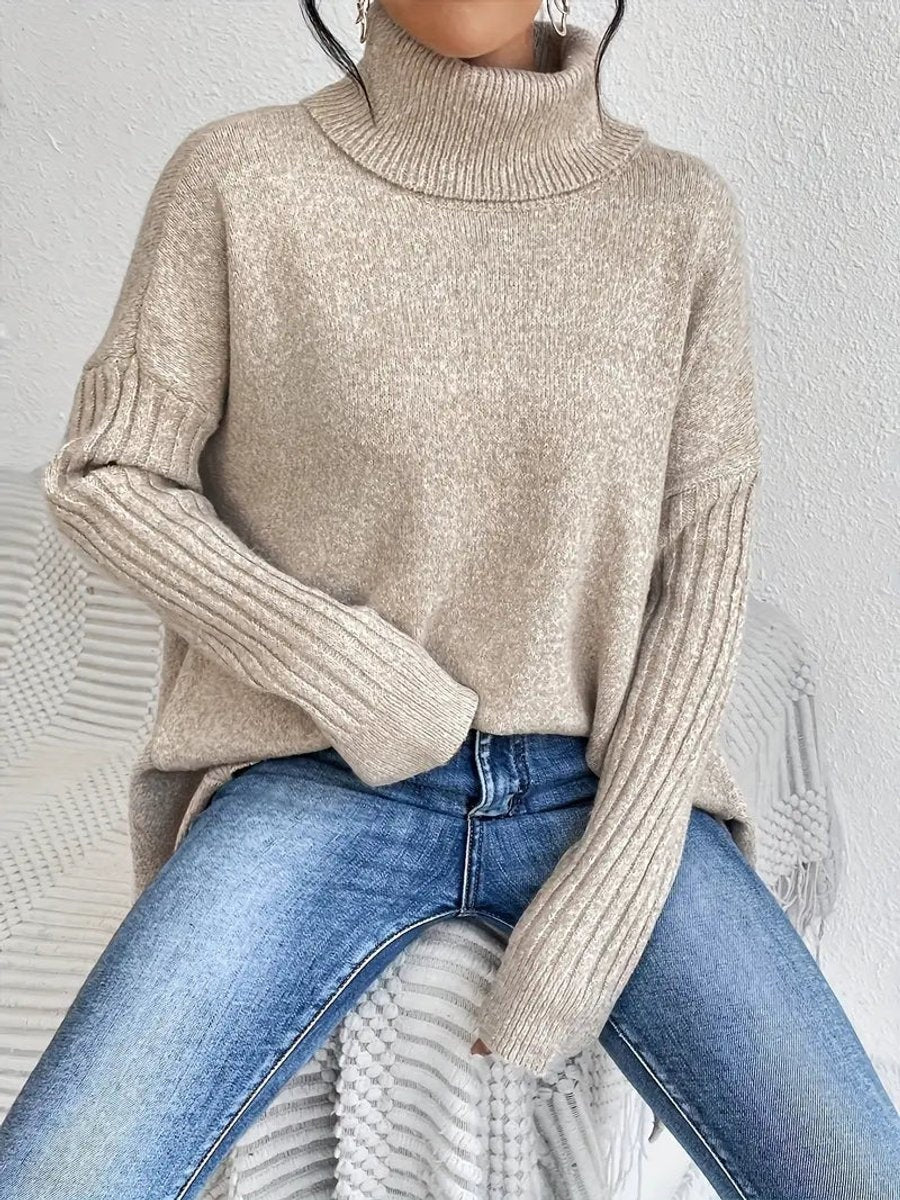 Aria™ | Jersey de cuello alto oversize con bajo asimétrico