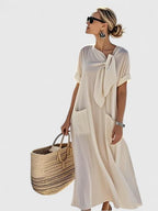 Morgan™ | Vestido largo suelto con lazo al cuello y bolsillos