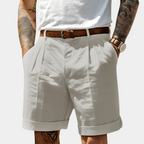 Marcus™ | Bermudas con pinzas y bajo vuelto